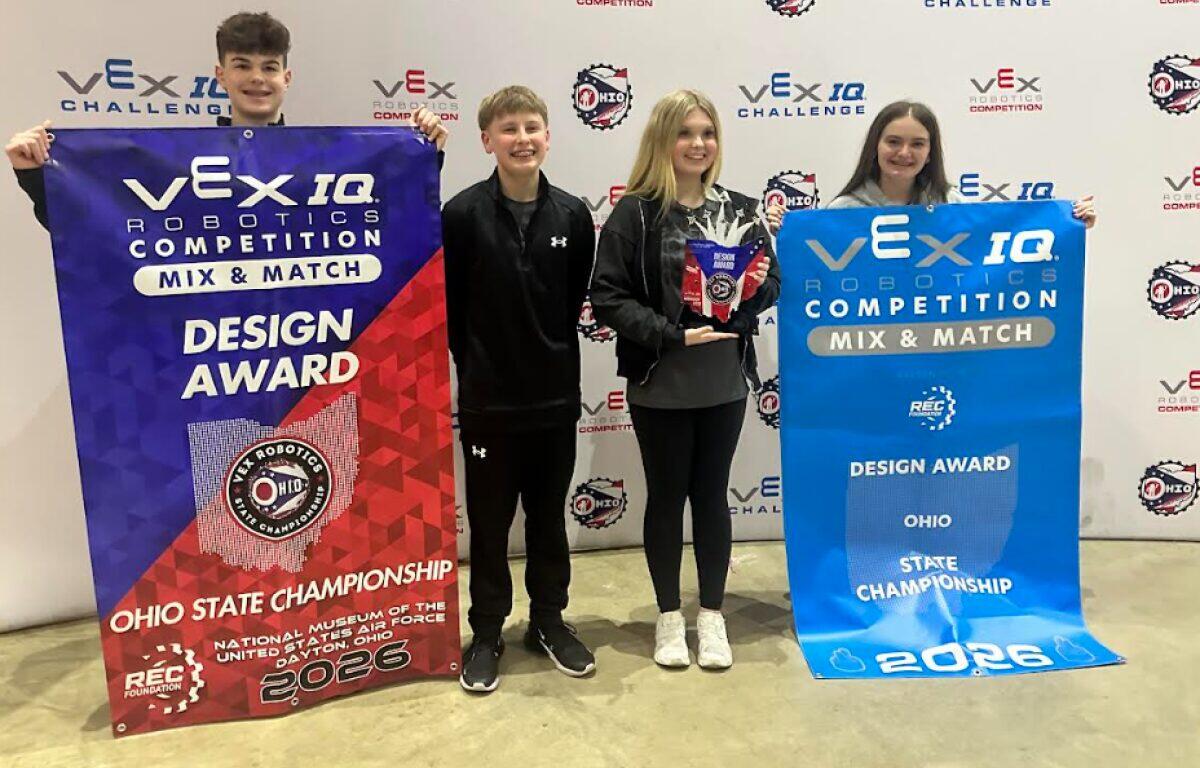Four young robotics competitors pose with VEX IQ banners, holding a Design Award trophy at the Ohio State Championship 2026.