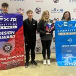 Four young robotics competitors pose with VEX IQ banners, holding a Design Award trophy at the Ohio State Championship 2026.