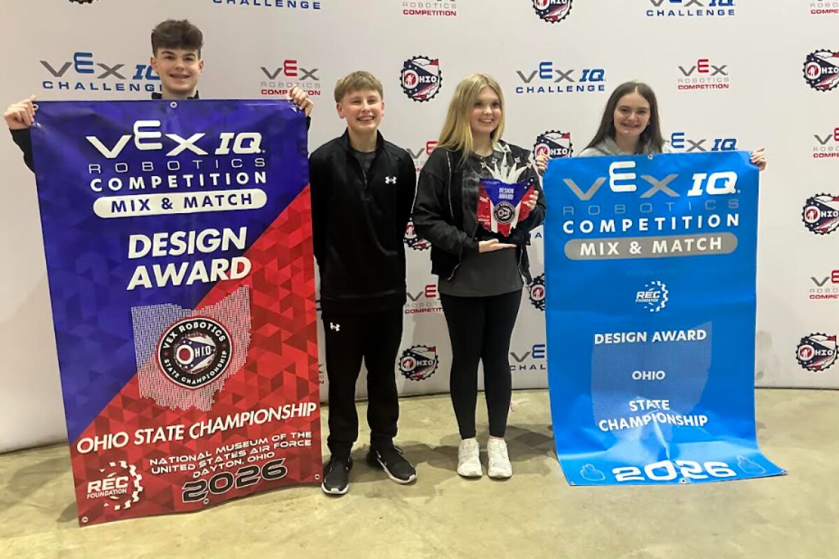 Four young robotics competitors pose with VEX IQ banners, holding a Design Award trophy at the Ohio State Championship 2026.