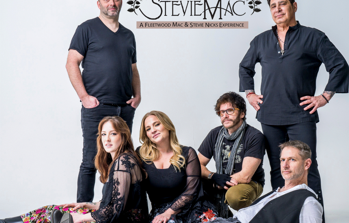 Six-member band posing for a promotional photo, logo StevieMac at top against a light backdrop (Fleetwood Mac & Stevie Nicks tribute).