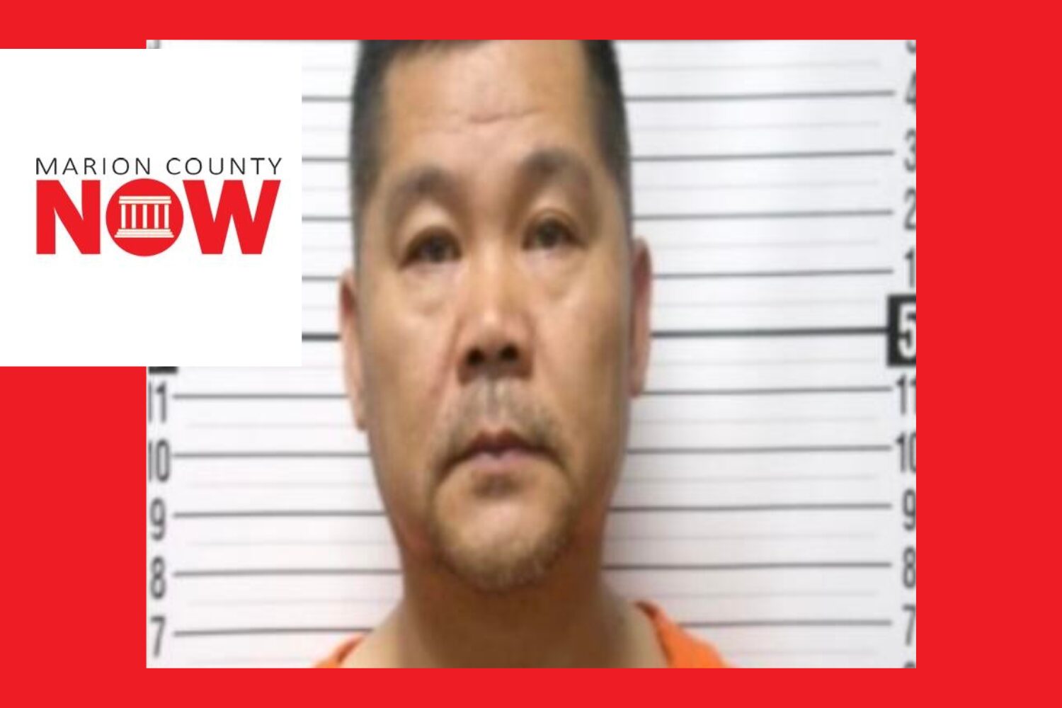 Mugshot-style photo of a man in an orange jumpsuit standing against a height chart; Marion County NOW logo overlays the left side.