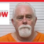Mugshot of an older man with white hair and beard in an orange jumpsuit, against a height chart with Marion County NOW logo overlaid on the left.