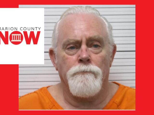 Mugshot of an older man with white hair and beard in an orange jumpsuit, against a height chart with Marion County NOW logo overlaid on the left.